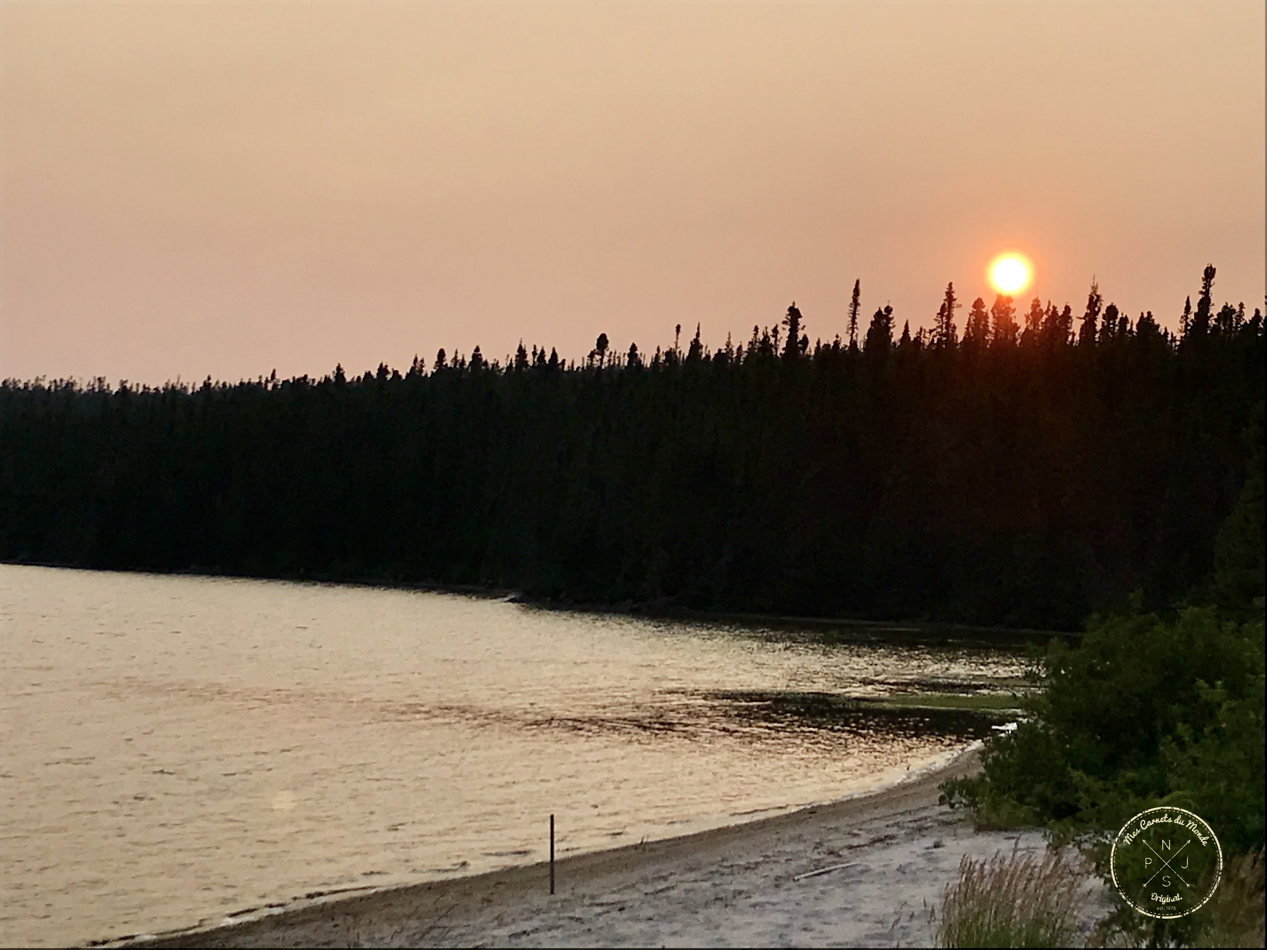 Coucher de soleil sur lac au Québec ecotourisme
